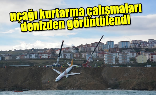 Trabzon'da pistten çıkan uçağı kurtarma çalışmaları denizden görüntülendi